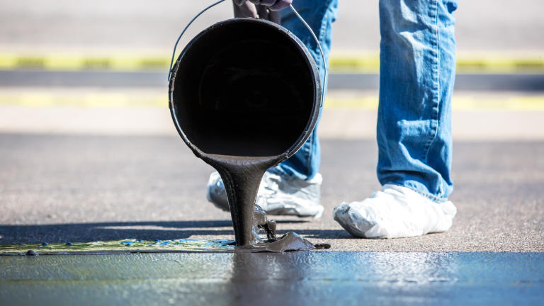 pouring tar in a pavement